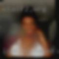 Looking naked woman sitting